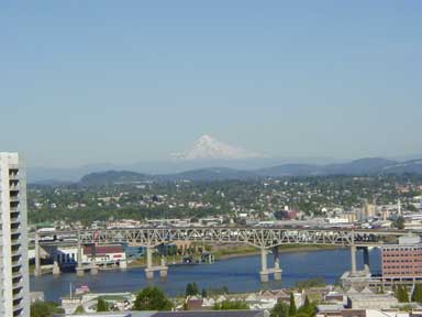 City Scene of Portland with mountains in the distance. 