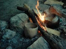 photo of pottery firing in open fire