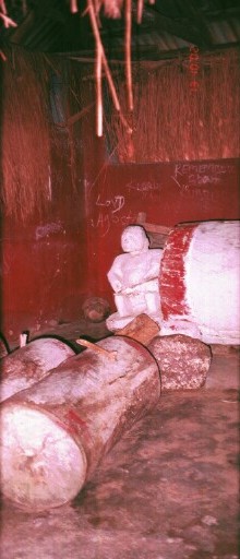 The village slit drum Ikoro shown with two auxiliary drums