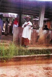 One of the chiefs showing a fishing gun at the former slave quarters