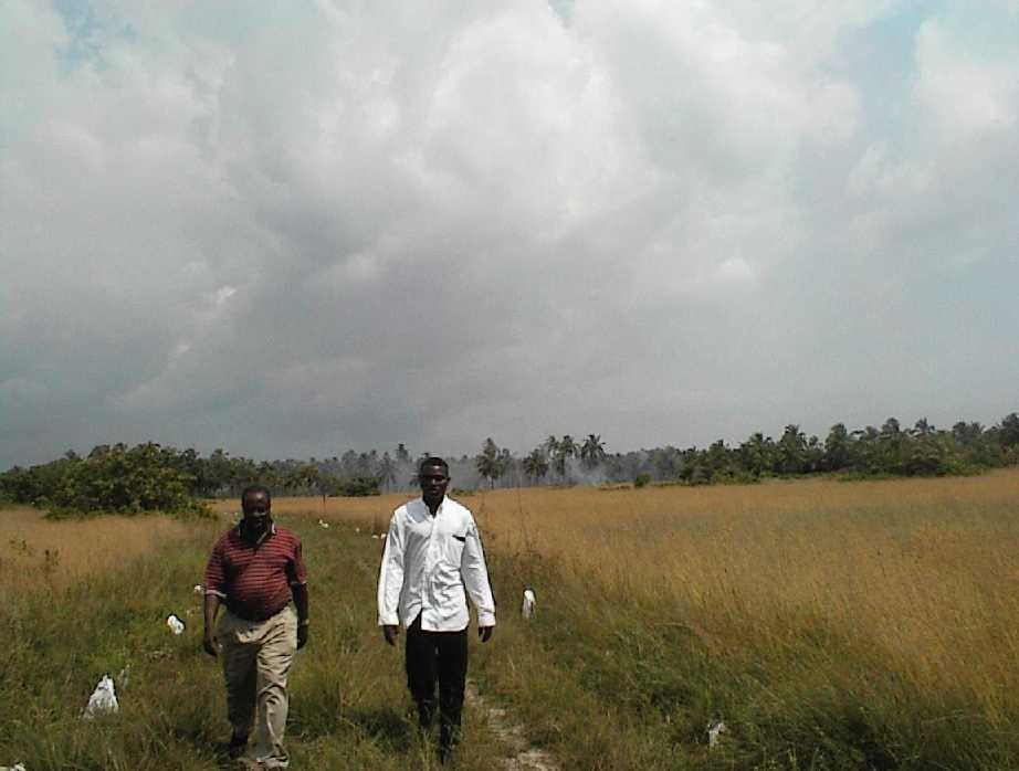 Njoku and Emmanuel returning from the Atlantic on the slave route through Coconut Island.