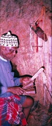 Chief priest making incantations to Chukwu Abiama in the Temple (left)